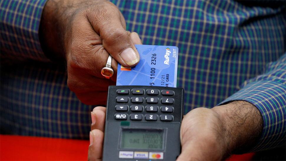RuPay ડેબિટ કાર્ડવાળા માટે ખુશખબરી! આગામી મહિનાથી લાગૂ થશે આ નિયમ RuPay ડેબિટ કાર્ડવાળા માટે ખુશખબરી! આગામી મહિનાથી લાગૂ થશે આ નિયમ