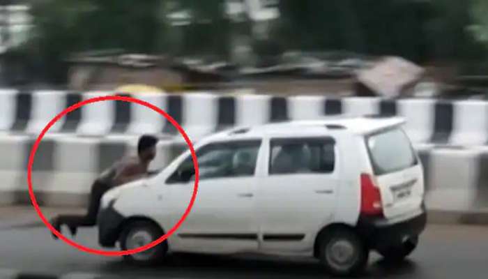 Video: બોનેટ પર લટકતો રહ્યો શખ્સ, તેમ છતાં ડ્રાઈવરે પૂરપાટ ઝડપે દોડાવી કાર
