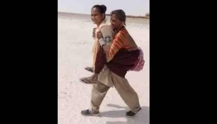 કચ્છ મહિલા કર્મીની આ સેવાને સલામ, વૃદ્ધાને ખભા પર ઉપાડીને મંદિર સુધી લઈ ગયા કચ્છ મહિલા કર્મીની આ સેવાને સલામ, વૃદ્ધાને ખભા પર ઉપાડીને મંદિર સુધી લઈ ગયા